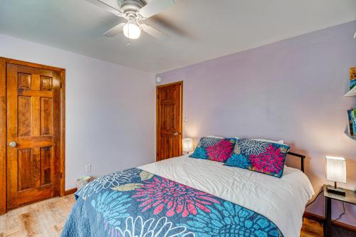 a bedroom with a bed and a ceiling fan at Breweries, Hiking Trails and Museums Monument House in Monument