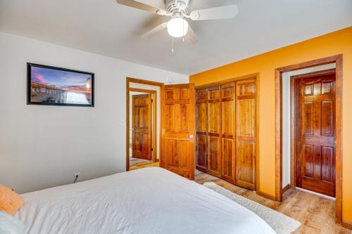 a bedroom with a bed and a ceiling fan at Breweries, Hiking Trails and Museums Monument House in Monument