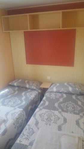 Ένα ή περισσότερα κρεβάτια σε δωμάτιο στο Camping Cubillas
