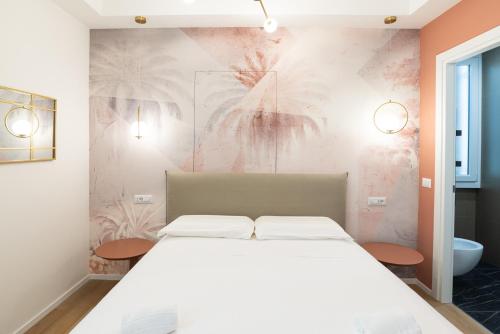 Postel nebo postele na pokoji v ubytování Maison Rasella Palace Suites