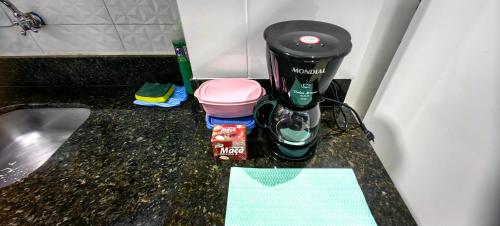 a coffee maker sitting on top of a counter at Apartamento 04 Centro de Igrejinha in Igrejinha