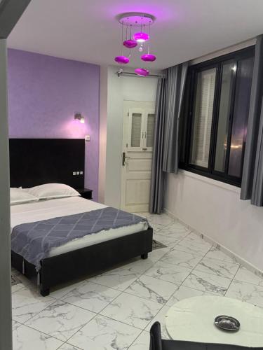 Ένα ή περισσότερα κρεβάτια σε δωμάτιο στο MARIN Hôtel