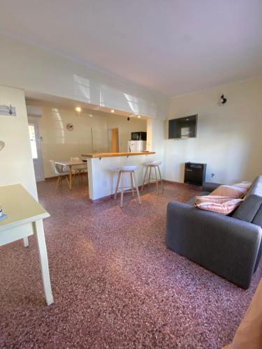 a living room with a couch and a table at N&G Alquiler Temporal in Venado Tuerto