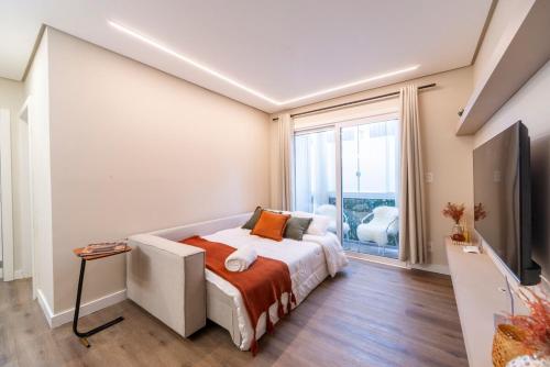 Postel nebo postele na pokoji v ubytování Apê novo a 1 min da Rua Coberta perfeito