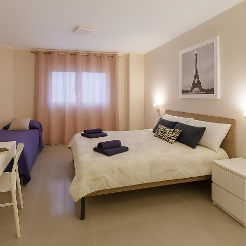 a bedroom with a large bed with the eiffel tower at La Dimora degli Artisti in Pescara