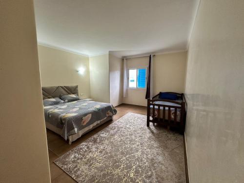 Ein Bett oder Betten in einem Zimmer der Unterkunft 213 mdiq Appartement parfait à louer à kabila vista 2 chambre salon piscine 2 balcon 90 mètres carré