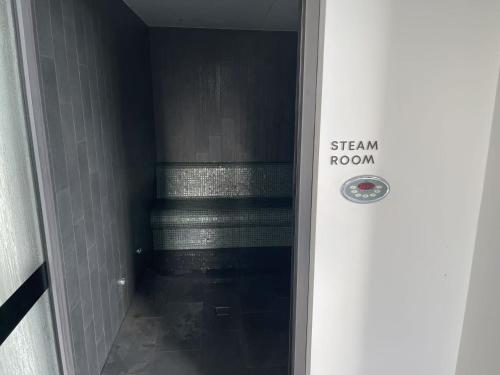 a door with a sign that says steam room at Queen's Wharf - Hosted by Nick in Brisbane