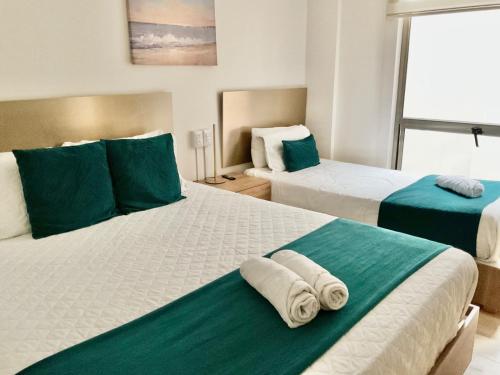 Postel nebo postele na pokoji v ubytování Hotel IQON Cuenca