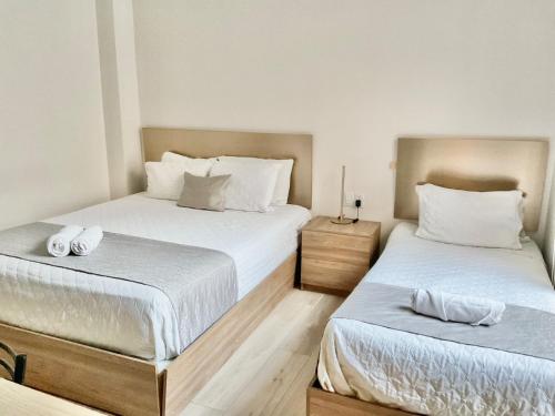 Postel nebo postele na pokoji v ubytování Hotel IQON Cuenca