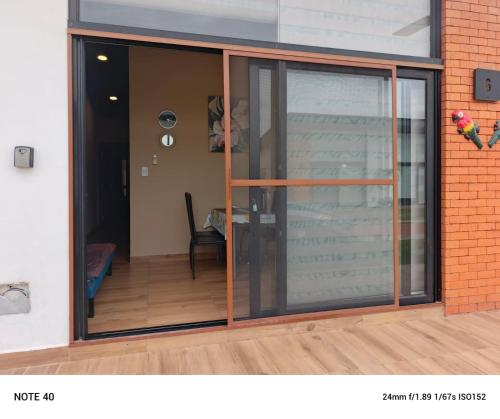 an open sliding glass door of a house at BEACH HOUSE Mar Adentro, lugar paradisiaco in Santa Cruz de la Sierra