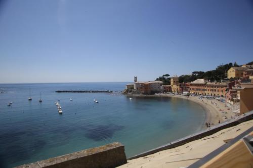 a view of a beach with boats in the water at Hotel Miramare & Spa in Sestri Levante
