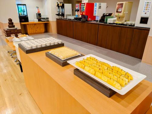 a buffet of food on a counter in a store at Itoen Hotel Shima in Nakanojo