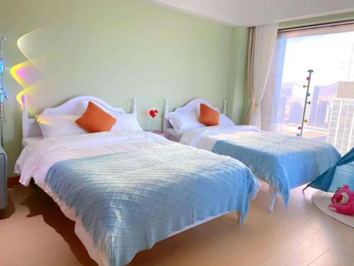 Katil atau katil-katil dalam bilik di Azure Haven Seaview Suites Shilaoren Coast