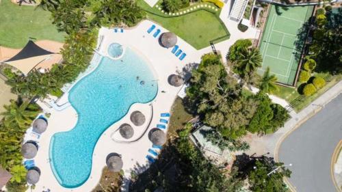 an aerial view of a pool with a resort at Royal Palm Resort on the Beach in Gold Coast