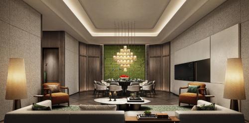 a dining room with a table and a chandelier at Suzhou Marriott Hotel in Suzhou