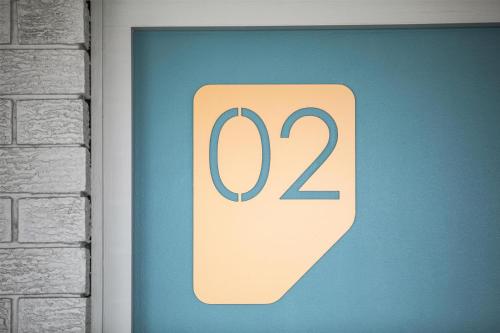 a sign with the number on a wall at Nightcap at Springwood Hotel in Springwood