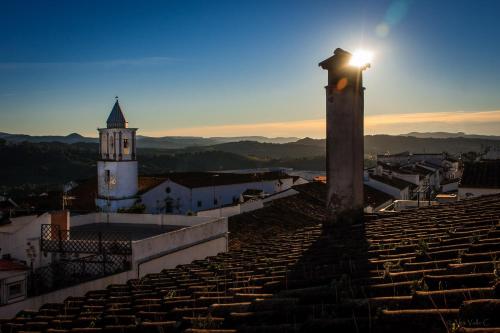 a light on top of a building with a tower at Posada La Casa Grande in Jimena de la Frontera
