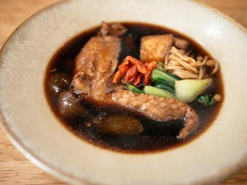 a bowl of soup with meat and vegetables on a table at Center - Vacation STAY 18175v in Kanuma
