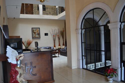 a lobby of a hotel with a reception desk at Hotel Conquistadores in Zacatecas