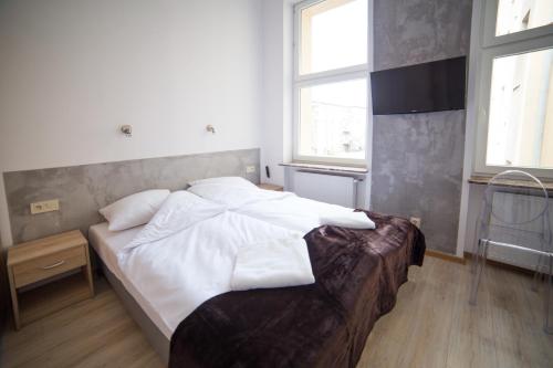 Un ou plusieurs lits dans un hébergement de l'établissement OperaHostel