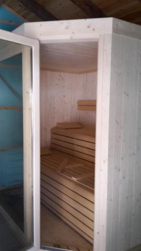 a small room with wooden shelves in a room at Hotel Wieslhof in Collepietra