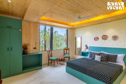 a bedroom with a bed and a window at StayVista at Petal Perch 4 BR and 2 BR with Bonfire in Kasauli in Kasauli
