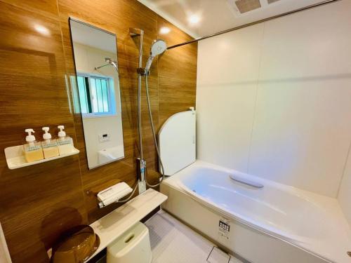 a bathroom with a toilet and a sink and a shower at Kanae - Vacation STAY 96254v in Tateyama