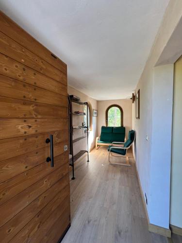 a living room with a sliding door and a couch at Agriturismo la casa degli amici in Cossignano