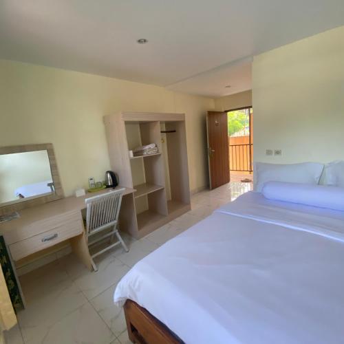 Ένα ή περισσότερα κρεβάτια σε δωμάτιο στο Labuan Bajo room