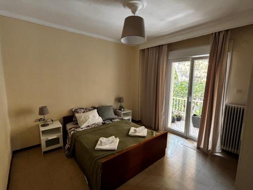 Postel nebo postele na pokoji v ubytování Ioanna apartment