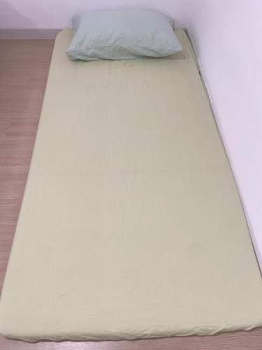 a large white bed with a pillow on it at Iskandar Sunway Grid X Park Walking distance to Bigbox Legoland in Nusajaya