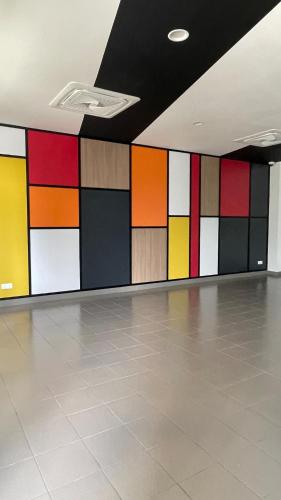 a room with colorful glass panels on the wall at Iskandar Sunway Grid X Park Walking distance to Bigbox Legoland in Nusajaya