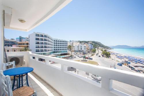a balcony with a view of the beach and buildings at Molos Seaside Apartment in Rhodes Town