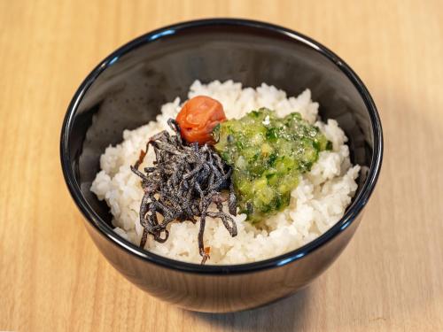 a black bowl of rice with broccoli and vegetables at APA Hotel Shonan Tsujido Ekimae in Fujisawa