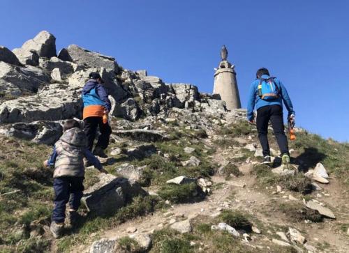a group of people walking up a rocky mountain at Magnifique Gîte 4 à 10 personnes in Nages