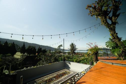 a view from the roof of a house with lights at Pondanu Living in Bedugul