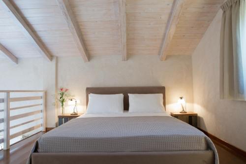 Postel nebo postele na pokoji v ubytování Ionian Horizon Villas