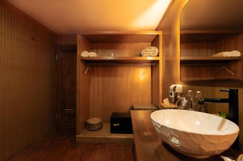 a bathroom with a large white sink in a room at Pondanu Living in Bedugul