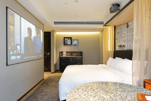 Katil atau katil-katil dalam bilik di Arthur Hotel Baiyun Station Xinshixu Subway Station Guangzhou
