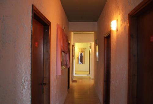 an empty hallway with a door and a hallwayngthngthngthngthngthngthngth at Violetta Hotel in Amoudara Herakliou