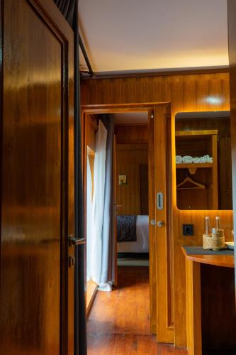 a hallway leading to a bedroom with a bed at Pondanu Living in Bedugul
