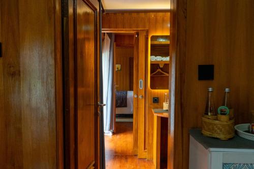 a kitchen with a door open to a hallway at Pondanu Living in Bedugul