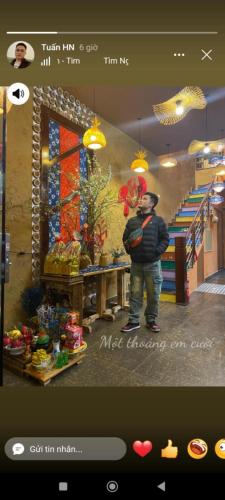 a picture of a man standing in front of a store at Bamboo Home in Sa Pa
