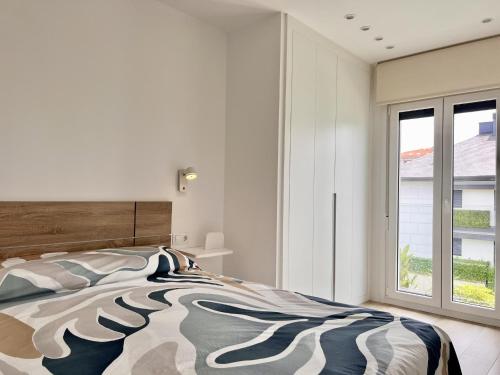 Postel nebo postele na pokoji v ubytování Suite Loredo Beach