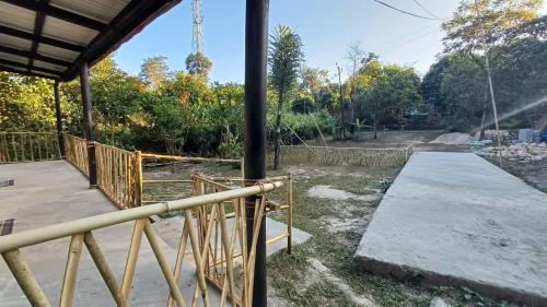 a house under construction with a ramp in the yard at Cozyo Stays Boutique Cabin Mawlynnong in Mawlynnong
