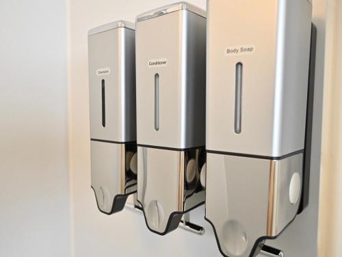 three servers hanging on a wall at ｹﾞｽﾄﾊｳｽ ﾊﾞｲｸﾔﾉﾆｶｲ in Hagi