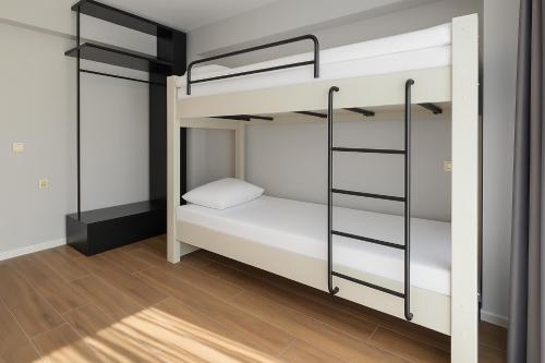 a room with two bunk beds and a wooden floor at Sia Hotel Thermal & Spa in Nilüfer