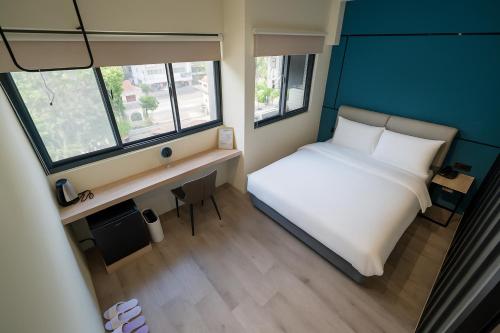 Postel nebo postele na pokoji v ubytování 星輝旅宿 MS Hotel 一中館
