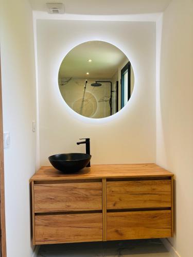 a bathroom with a sink and a mirror at L'Esprit Sud, 4 Suites & Piscine in Vence