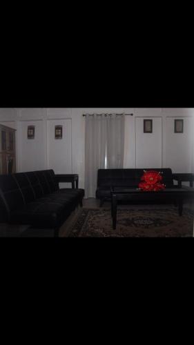 a living room with a couch and a coffee table at Beautiful home in Maloney Gardens, Arouca Trinidad in Arouca